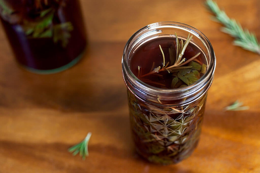 Herbed red wine vinegar, infused with fresh parsley, sage, and rosemary, is excellent on salads, sandwiches, or pastas.
