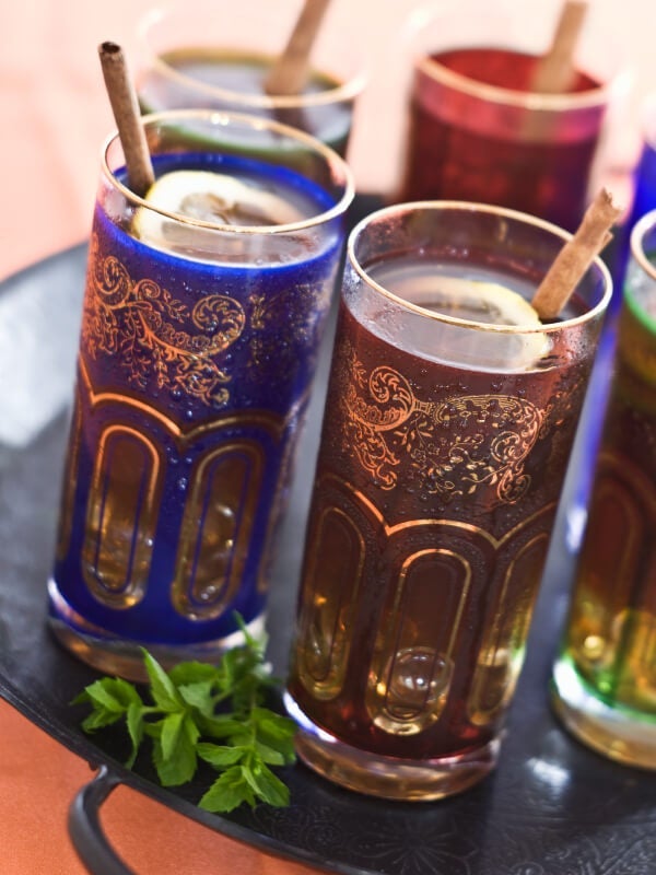 Combine spices with citrus and fresh mint for a flavorful green tea drink.