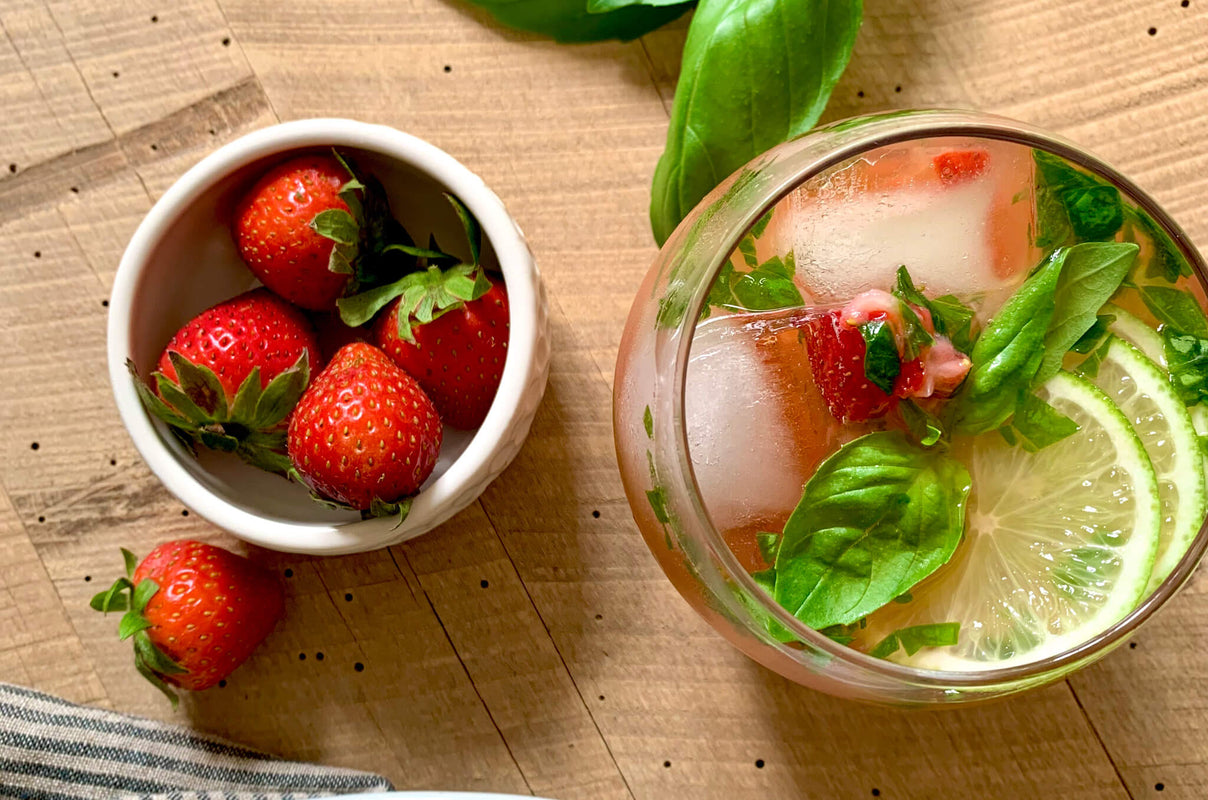 A strawberry margarita topped with basil.