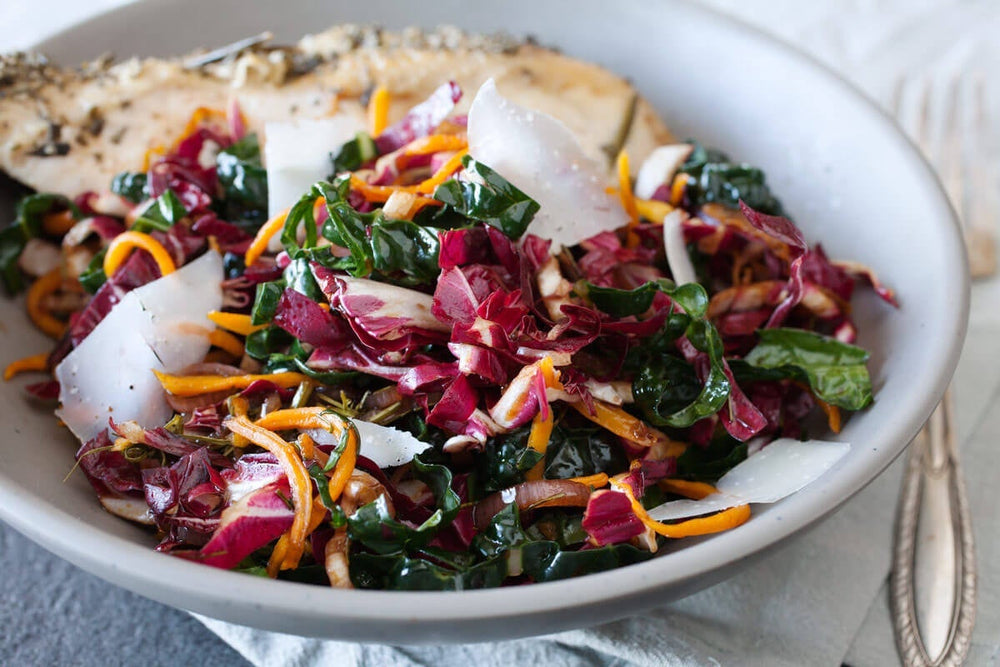 A winter slaw made with roasted butternut squash, raw radicchio, kale, and a warm vinaigrette.