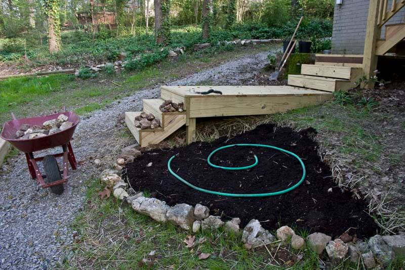 Create a spiral shape with a garden hose.