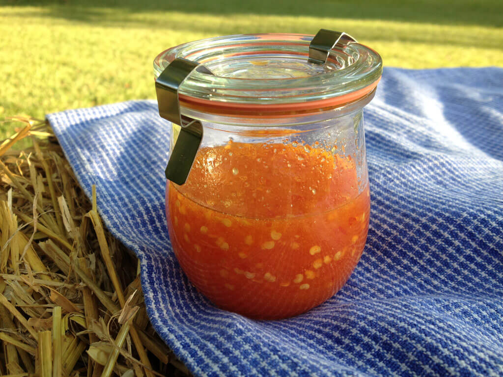 small jar of homemade sriracha sauce