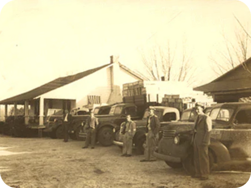 Historical photo of Bonnie and Livingston Paulk arriving in Union Springs, Alabama in 1918, planting cabbages in the backyard.